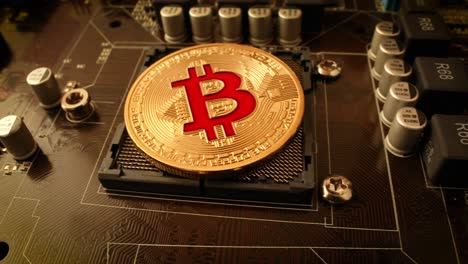 gold bit coin btc coins on the motherboard. bitcoin is a worldwide cryptocurrency and digital payment system called the first decentralized digital currency.