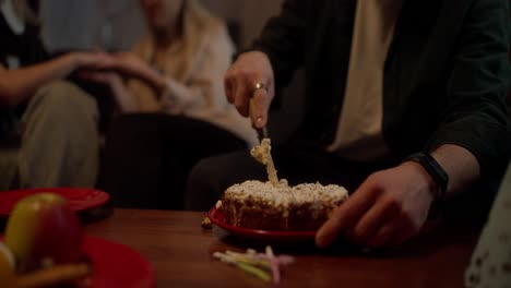 friends celebrating birthday with cake