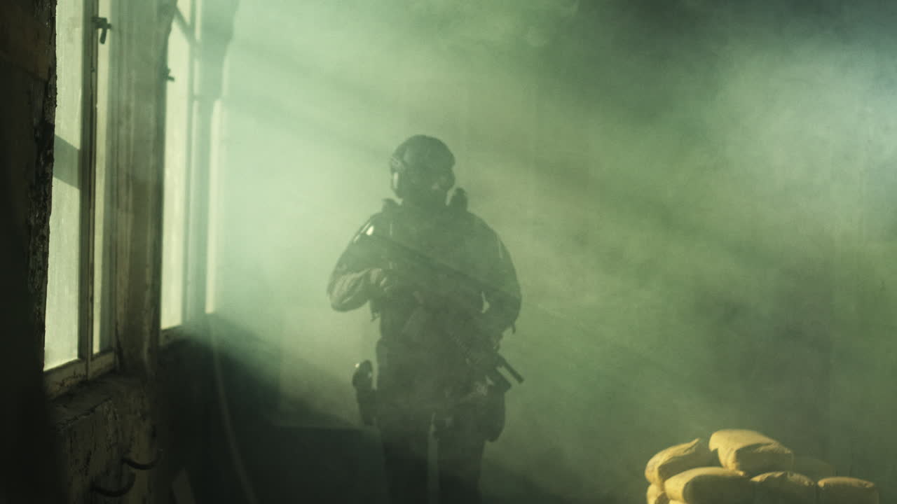 Soldier in a tactical operation in a building with smoke