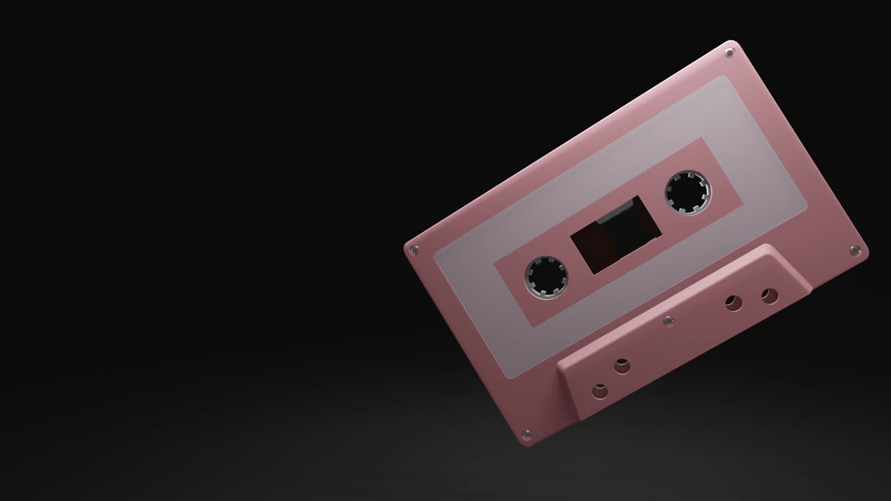 cinta de cassette de color rosa pálido aislada en el espacio de texto negro.