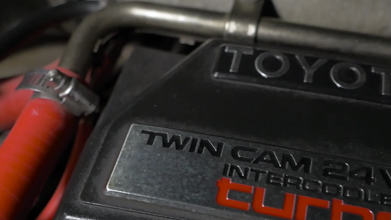 A gimbal movement across the engine bay of a MK3 Toyota Supra. The top engine cover being the main subject in this shot.