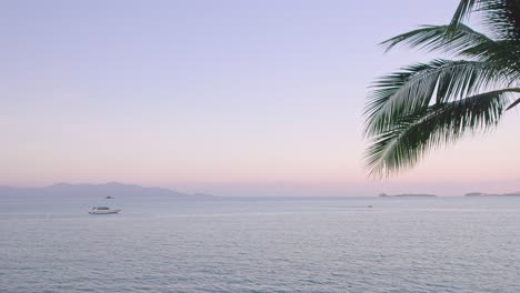 Colorful-4k-Drone-Sunset-Ocean-Views-Over-the-Coast-at-Bo-Phut-Beach-in-Koh-Samui-Thailand,-Including-Anchored-Yachts,-Coconut-Palms,-and-Beachfront-Resorts