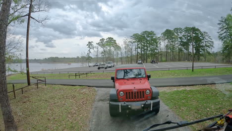 time lapse of activity at the boat ramp and parking lot on sam rayborn lake on a cloudy day