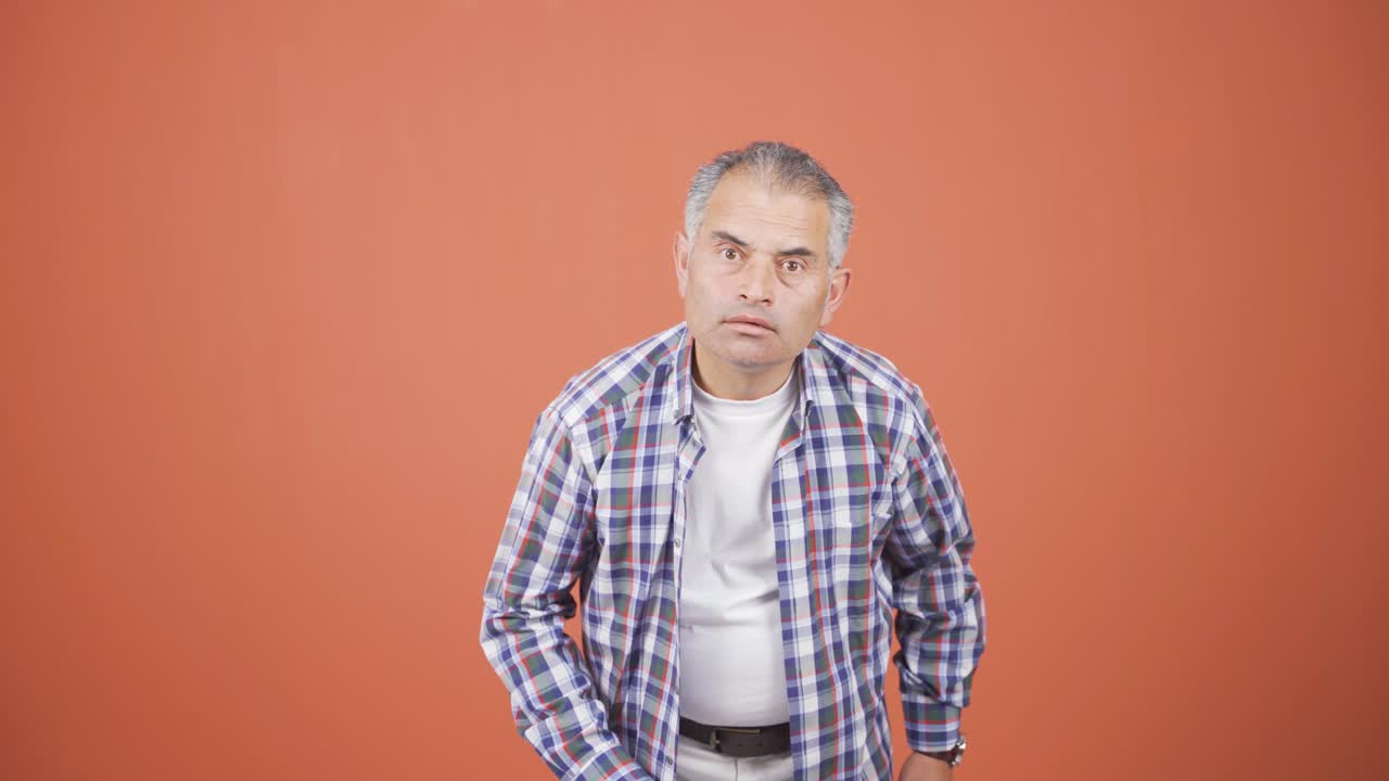 Man looking at camera with curious expression.
