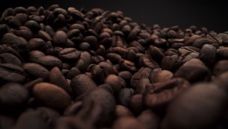 macro probe shot of coffee beans on black background for copy space