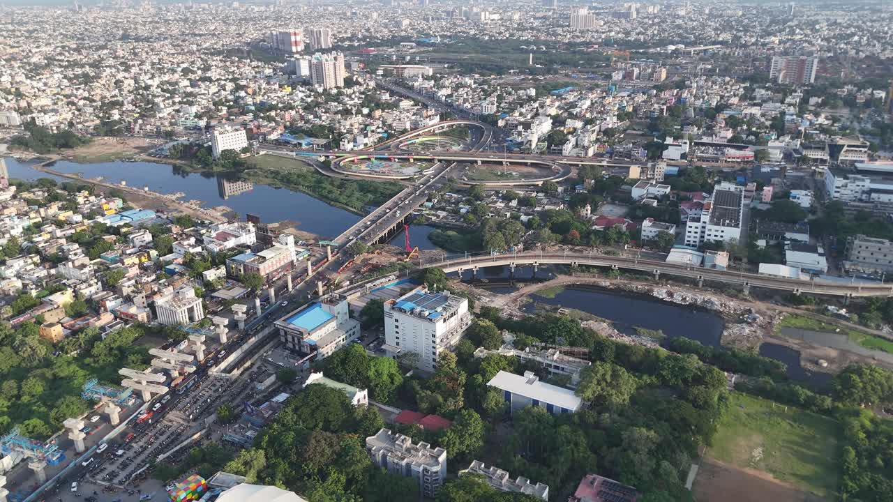 Bird’s-eye shot capturing traffic movement, butterfly bridge and peaceful urban atmosphere in Chennai