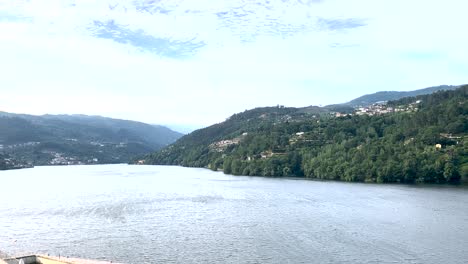 View-of-the-mountain-with-the-river-in-front-on-a-windy,-cloudy-day