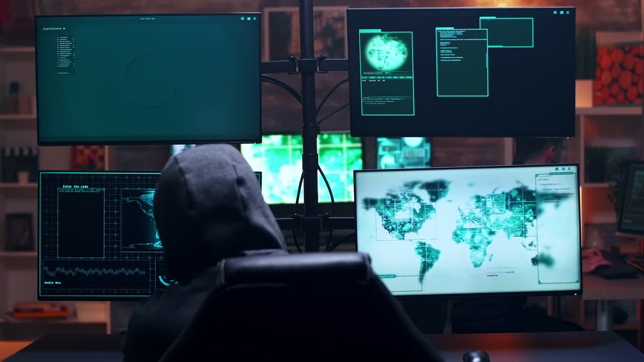 Back view of male hacker wearing a hoodie