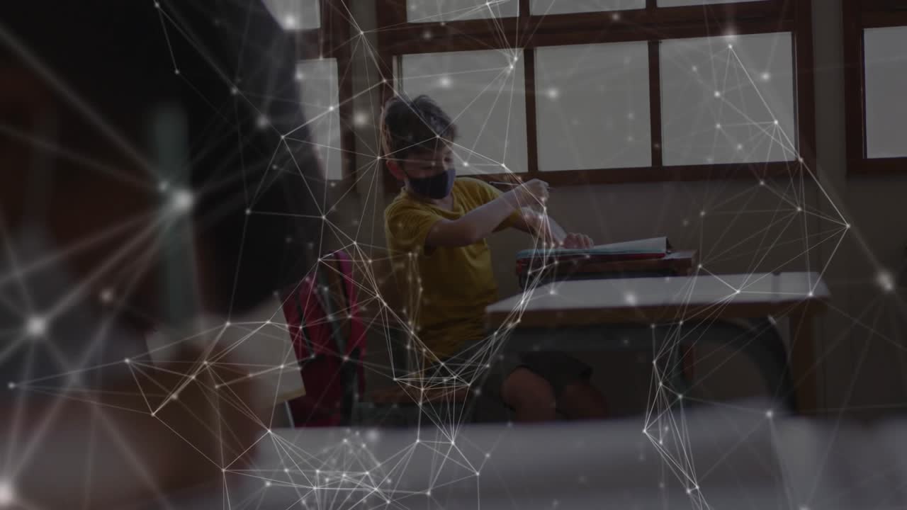 Boy sitting desk taking notes by window, watching teacher holding papers then resuming writing