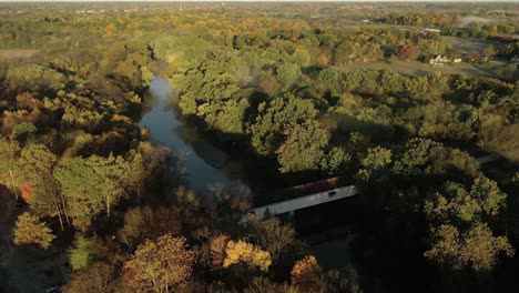 k drone fly around historic covered bridge over