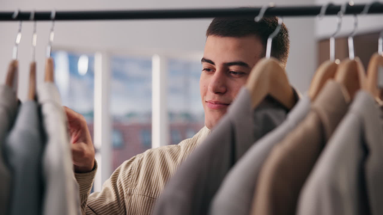 Man browsing clothes on a rack