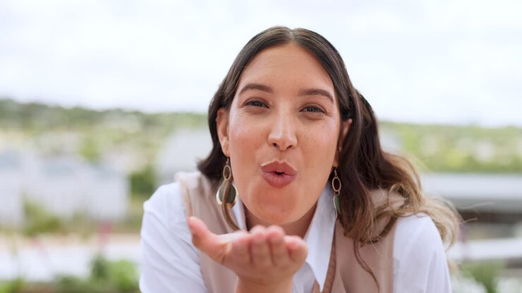 Peace, sign and woman blow kiss