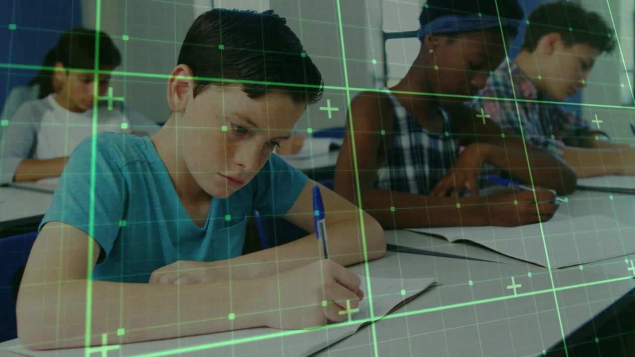 Front male student writing in class camera shifting and showing green grid tracking pen for class