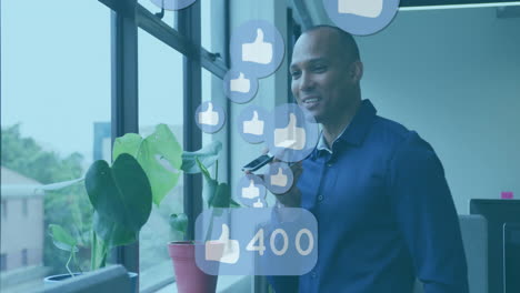 animation of thumbs up icons and changing numbers, biracial man speaking on speaker of cellphone