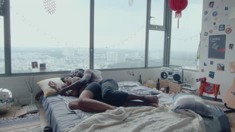 young couple cuddling and sleeping in the bedroom