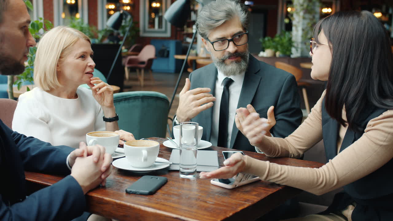 Business Team Meeting in a Coffee Shop