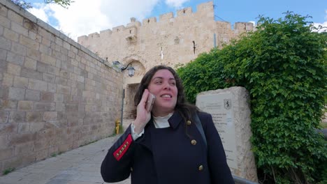 woman talking on phone in jerusalem's old city