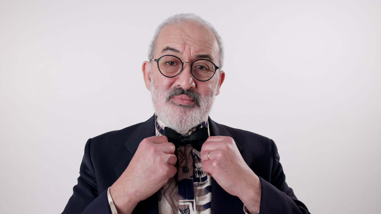 Portrait of a man wearing a bow tie and glasses