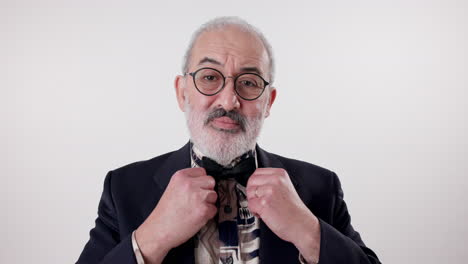 portrait of a man wearing a bow tie and glasses