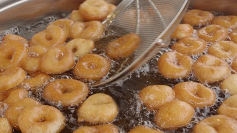 fried doughnuts in boiling oil