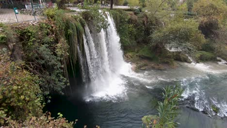 tilting shot of the cascading upper duden waterfall in the city of antalya turkey, bright daylight