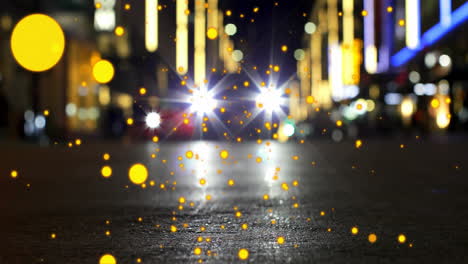 glowing particles animation over city street with car headlights at night