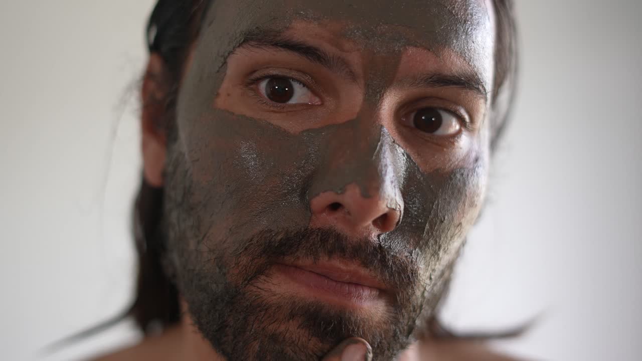 man using a clay mask on his face, Skincare