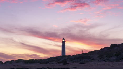 beautiful and colorful timelapse of sunset in faro de trafalgar lighthouse, cadiz, spain