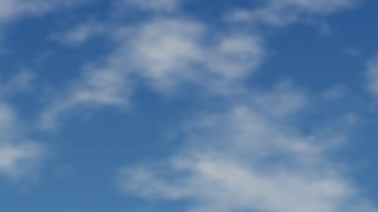 Nuvole bianche e soffici fluttuano lentamente attraverso un cielo azzurro brillante in un ciclo orizzontale continuo.