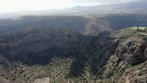 Caldera-Bandama,-Gran-Canaria:-aerial-view-flying-over-the-crater-of-this-geological-formation-of-the-Canary-Islands