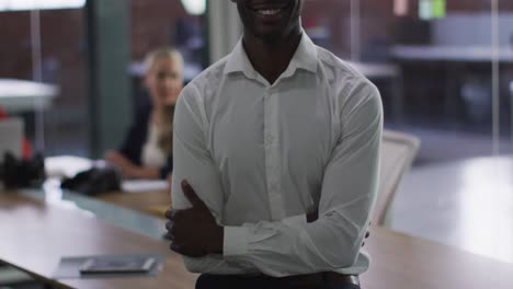 portrait of african american businessman in meeting room looking to camera smiling