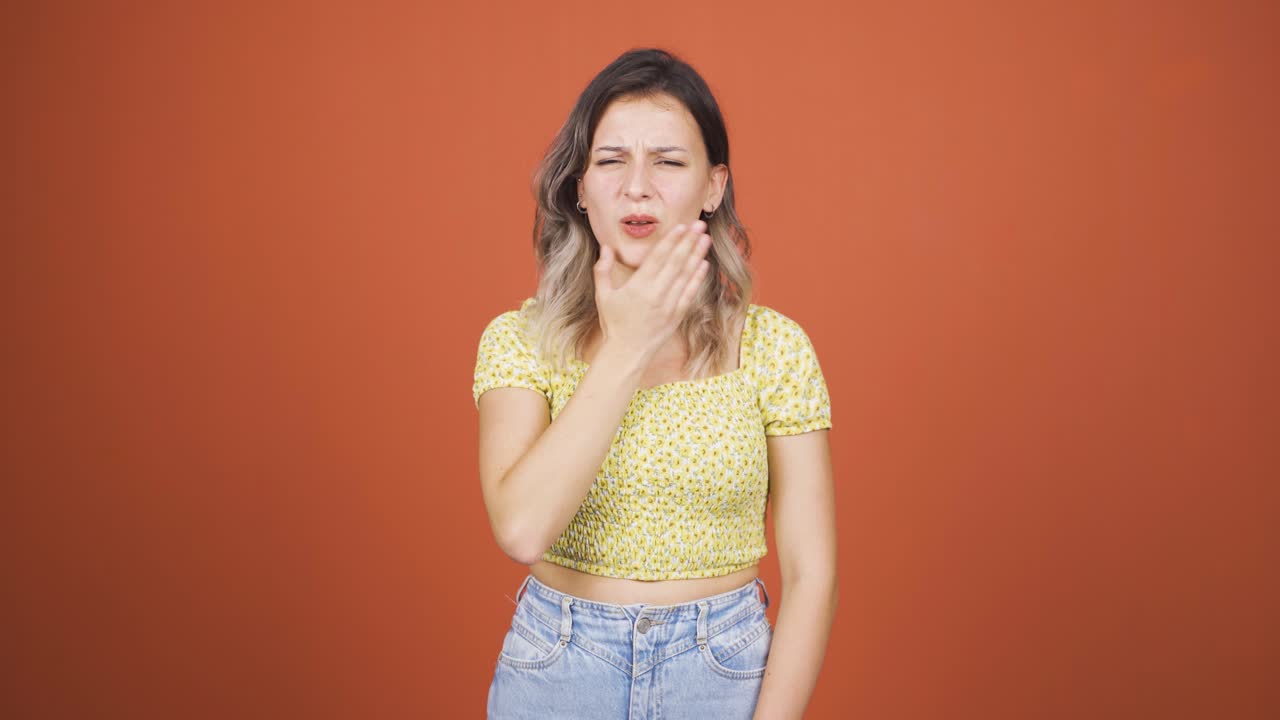 Young woman with toothache.