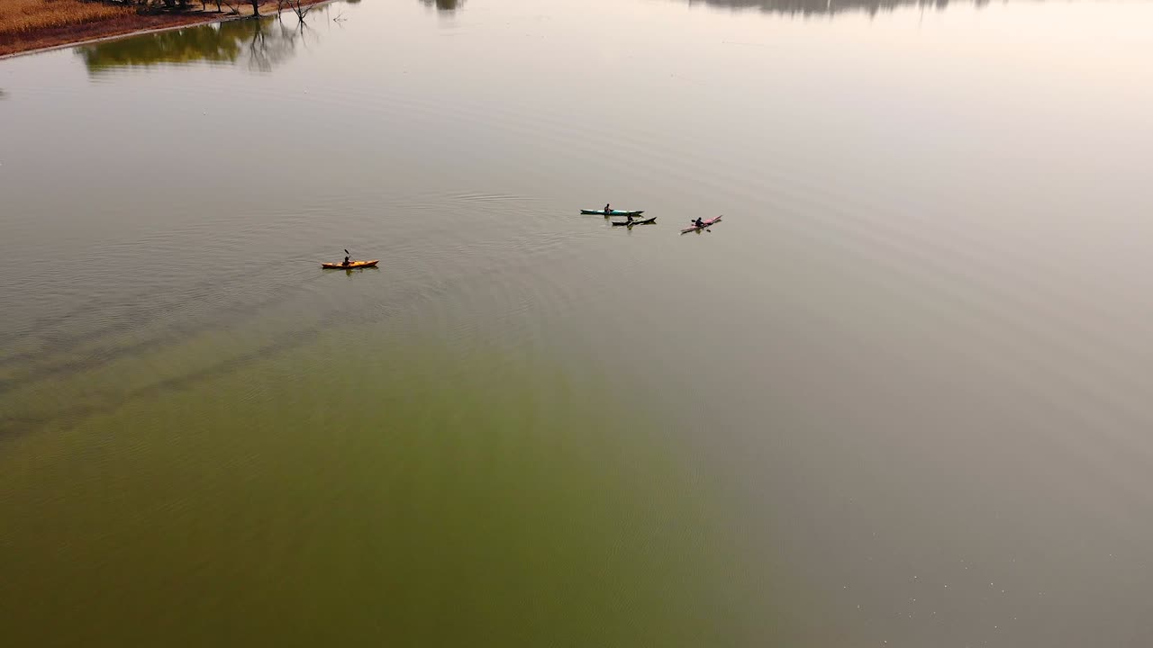 Aerial Perspective of Canoeist on Tranquil, Reflective Lake Waters in Mexico