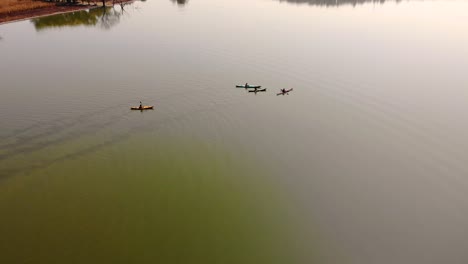 Aerial-Perspective-of-Canoeist-on-Tranquil,-Reflective-Lake-Waters-in-Mexico