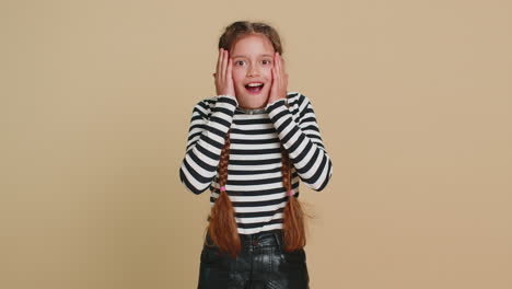 excited child girl kid surprised shocked by sudden victory good win news celebrating wow reaction