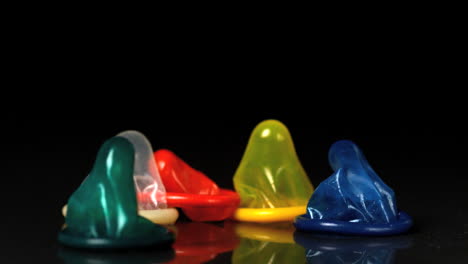 couloured condoms falling over