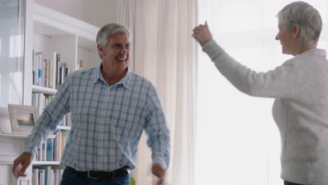 happy-old-couple-dancing-at-home-celebrating-retirement-anniversary-having-fun-dance-enjoying-relationship-milestone-celebration-4k