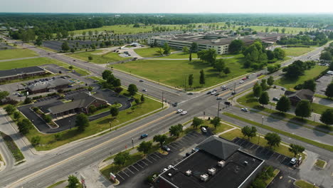 daytime cityscape of intersection in futuristic-looking area of lawrence, in