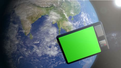 3d animation of television set in the space. television set with green screen orbiting and monitoring the earth from space.