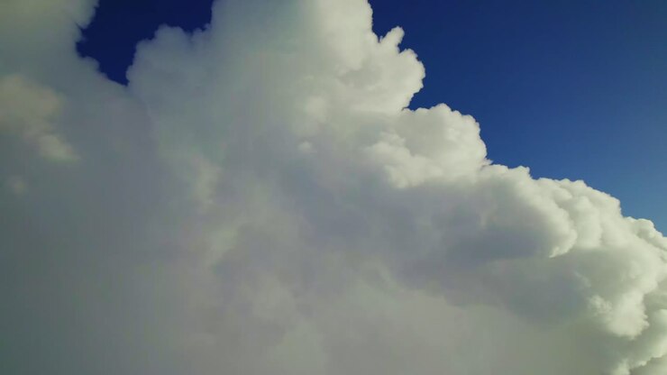 Fluffy Clouds in a Blue Sky