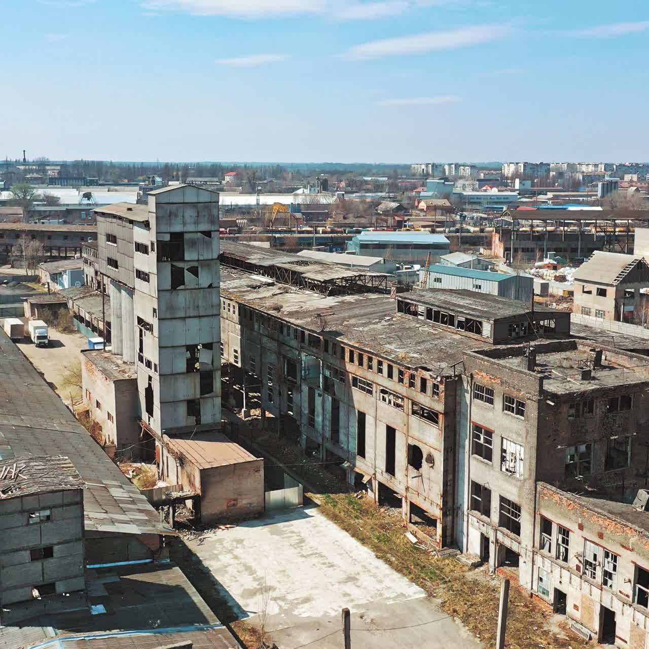 Abandoned building. Aerial view of an old factory ruin and broken windows.