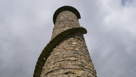 historic ballycorus leadmines tower with staircase against gloomy sky at carrickgollogan park near kilternan in county dublin, ireland