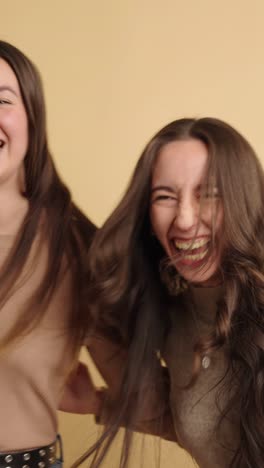 two friends joyfully celebrating and laughing together