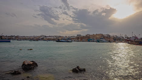 Marsaxlokk-seashore-harbour-timelapse,-port-of-Malta-island