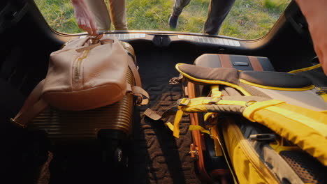 bags and backpacks get out of the trunk of the car