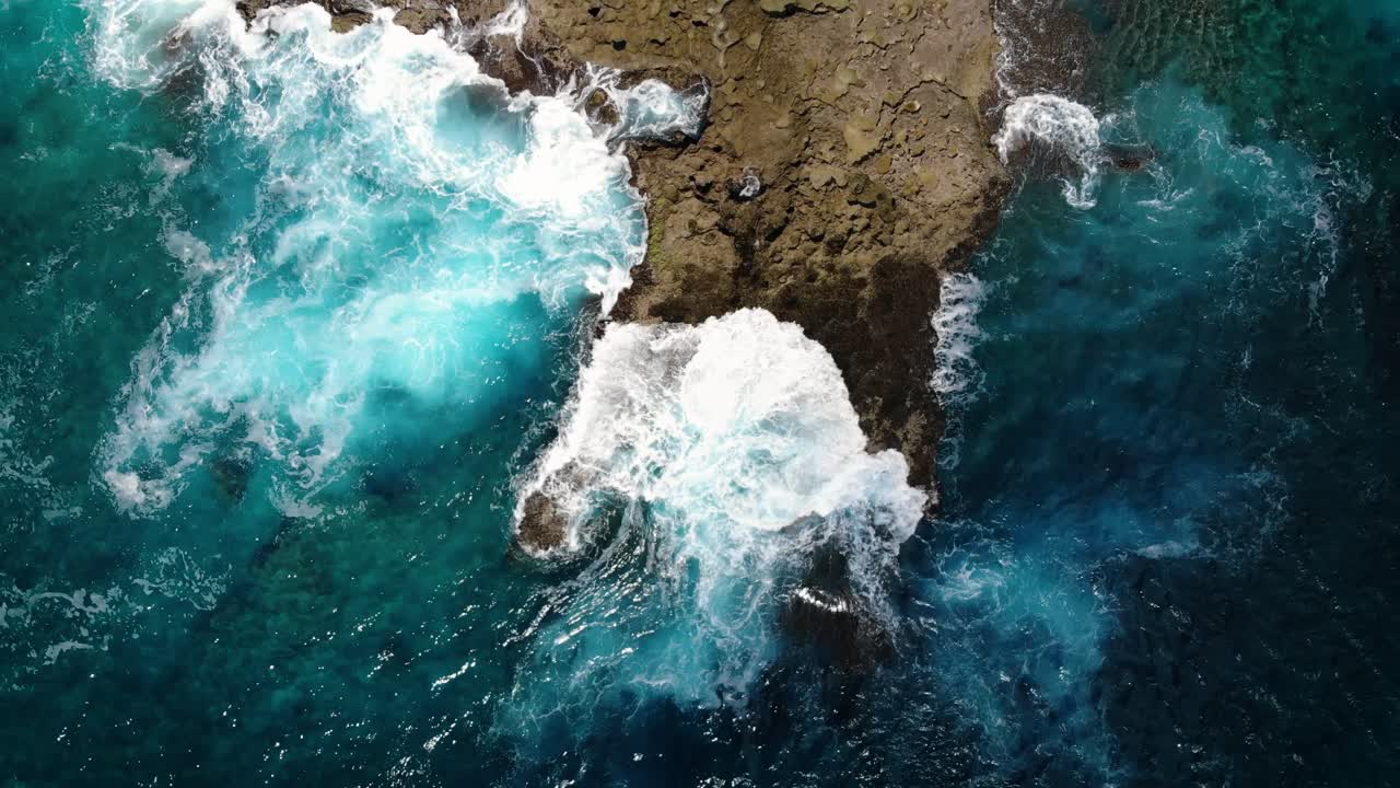 A birds eye shot of the coastline on Hawaii.