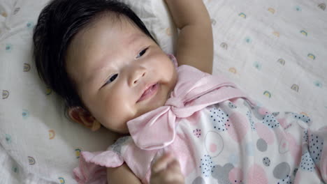 adorable baby girl in pink dress