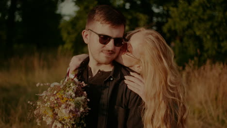 Positive-Woman-Supporting-Young-Man-Outdoors-At-Sunset-1