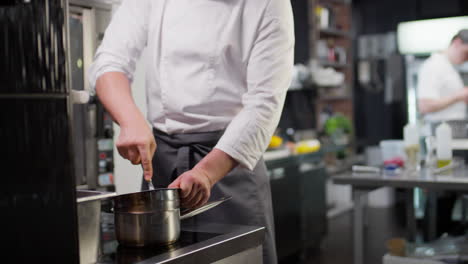 restaurant chef cooking on water bath
