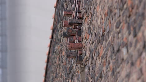 abstract brick wall with protruding bricks